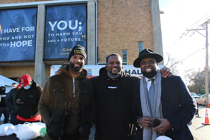 Former Chicago Bears Players Matt Forte and Anthony Adams, with The Reverend Charlie Dates, Pastor of Progressive Baptist Church, during the What’s Your Forte Foundation’s Thanksgiving Giveaway.