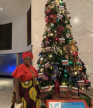 Sheila Wesonga, along with African Americans and Kenyans, decorated the Kenyan tree for the Museum of Science and Industry’s Christmas Around the World and Holidays of Light display.