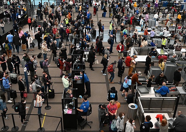 Travelers make their way through TSA security at Denver International Airport the day before Thanksgiving on November 24, in Denver, Colorado.
Mandatory Credit:	RJ Sangosti/MediaNews Group/The Denver Post/Getty Images