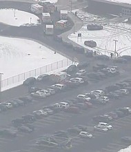 First response vehicles are seen in the parking lot of Oxford High School where a suspected school shooting was reported and a suspected shooter is in custody, according to Oakland County Undersheriff Michael McCabe.
Mandatory Credit:	WNEM