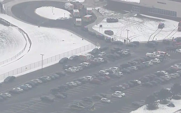 First response vehicles are seen in the parking lot of Oxford High School where a suspected school shooting was reported and a suspected shooter is in custody, according to Oakland County Undersheriff Michael McCabe.
Mandatory Credit:	WNEM