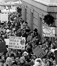 The justices are gathering to consider whether Roe v. Wade should be overturned, and pictured, an estimated 5,000 people march around the Minnesota Capitol building protesting the U.S. Supreme Court's Roe v. Wade decision, in St. Paul, Minn., Jan. 22, 1973.
Mandatory Credit: AP/FILE