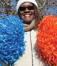 Monica Nicholson of Sandston shakes blue and orange pompomms, Armstrong High School’s colors, where her mother, Janie Preston of Chesterfield, was a cheerleader before graduating in 1960.