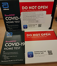 Users of the free COVID-19 rapid antigen at-home test kits are linked virtually by cellphone or computer with an eMed assistant who guides the user through the process.