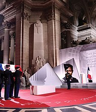 Soldiers carry the cenotaph containing soil from various places where famed Black French-American singer and dancer Josephine Baker lived, covered with a French flag, during her Nov. 30 induction ceremony into the Pantheon, where key figures from France’s history are honored in Paris.