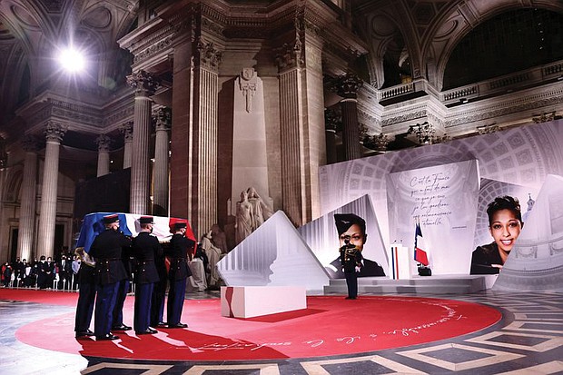 Soldiers carry the cenotaph containing soil from various places where famed Black French-American singer and dancer Josephine Baker lived, covered with a French flag, during her Nov. 30 induction ceremony into the Pantheon, where key figures from France’s history are honored in Paris.
