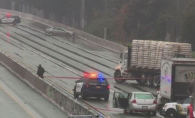 KOIN-TV shows the scene on I-5 in north Portland after police killed an armed suspect following an hours-long incident Monday morning that included a home invasion, several carjackings and gunfire.