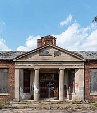“School Building C” at Altgeld Gardens in Chicago faced demolition when it was included on the 2021 Most Endangered Historic Places in Illinois. The community wanted to see the school, built in 1944, rehabilitated and reused for jobs and vocational training opportunities for Altgeld Gardens residents. Since the Most Endangered listing in May 2021, Chicago Public Schools has halted demolition plans. Photo credit: Sean Reilly.
