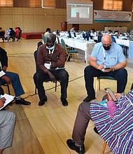 Participants at the third symposium on misleading theologies in Nairobi hold group discussions Nov. 22.