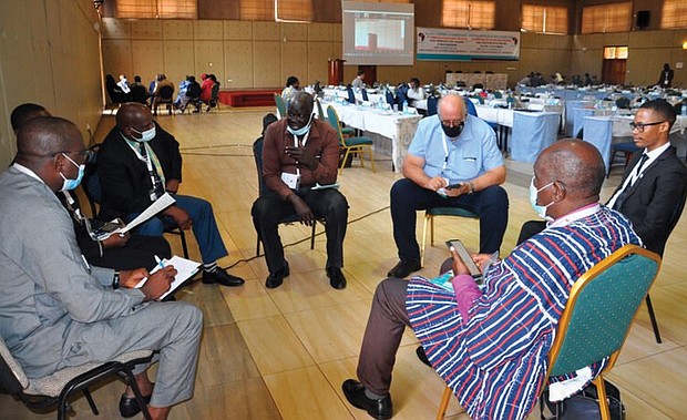 Participants at the third symposium on misleading theologies in Nairobi hold group discussions Nov. 22.