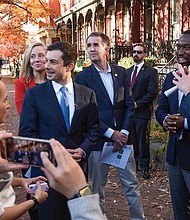 U.S. Secretary of Transportation Pete Buttigieg, center, listens as Virginia elected officials talk about how Jackson Ward was dissected with the construction of Interstate 95. Taking him on a tour of the Richmond neighborhood Dec. 3 are, from left, U.S. Rep. A. Donald McEachin, U.S. Rep. Abigail Spanberger, Gov. Ralph S. Northam, Mayor Levar M. Stoney and U.S. Sen. Tim Kaine.