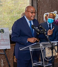 Cutline: Commissioner Rodney Ellis, left, with Houston Mayor Sylvester Turner and Texas Southern University President Dr. Lesia L. Crumpton-Young looking on, outlines the recently completed $12 million construction project on Cleburne Street near TSU. The work is part of a $43.1 million investment made by Harris County Precinct One and the City of Houston to repair five streets around TSU and University of Houston.