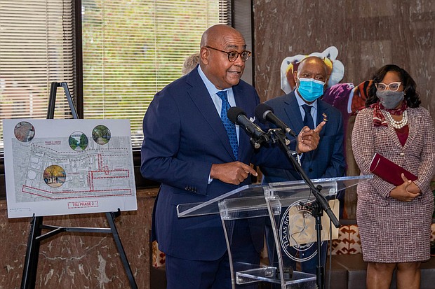 Cutline: Commissioner Rodney Ellis, left, with Houston Mayor Sylvester Turner and Texas Southern University President Dr. Lesia L. Crumpton-Young looking on, outlines the recently completed $12 million construction project on Cleburne Street near TSU. The work is part of a $43.1 million investment made by Harris County Precinct One and the City of Houston to repair five streets around TSU and University of Houston.