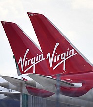 Tailfins of parked Virgin Atlantic passenger aircraft are pictured on the apron at Heathrow Airport, west of London on April 2, 2020, as life in Britain continues during the nationwide lockdown to combat the novel coronavirus COVID-19 pandemic.
Mandatory Credit:	BEN STANSALL/AFP via Getty Images