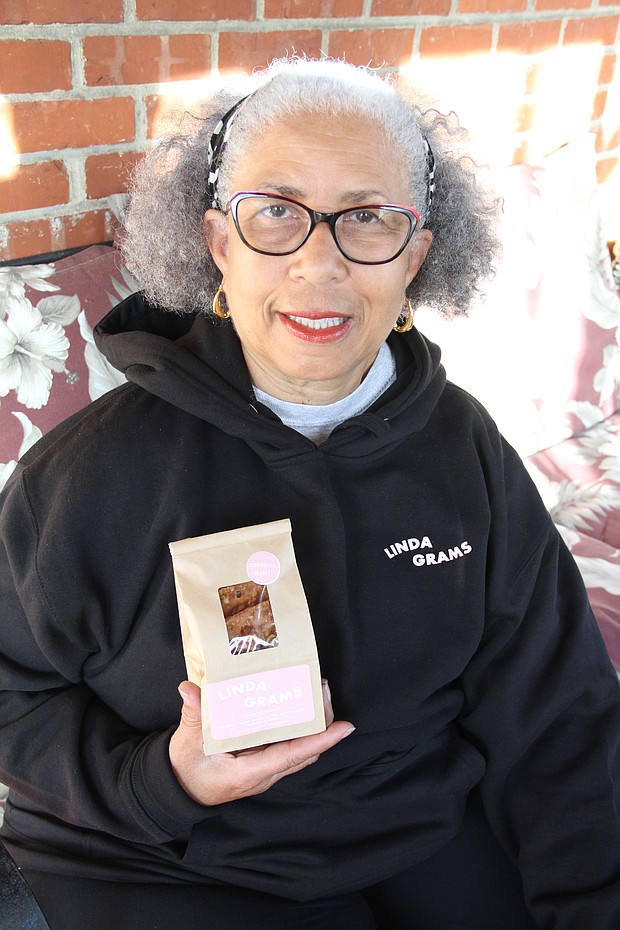 Linda Shaw holds a package of her new graham cracker-based cookies, LindaGrams.