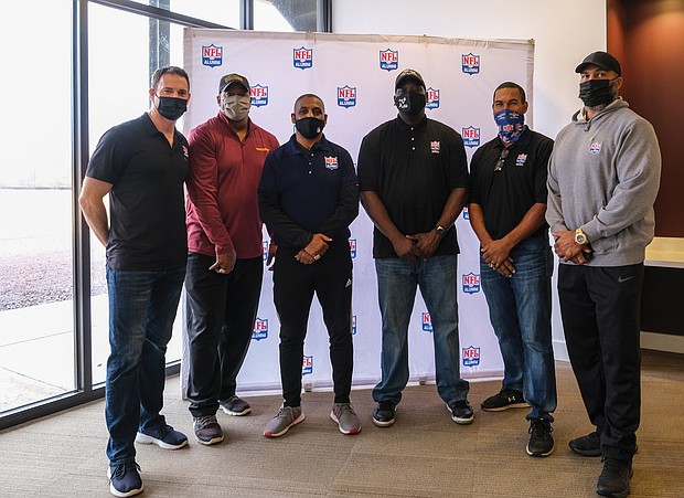 Several former NFL players met and signed autographs for Richmond area fans last Saturday during an event to encourage people to get vaccinated against COVID-19 held at the Bon Secours Training Center. Attending the event are, from left, Kyle Richardson, former punter for the Baltimore Ravens and NFL Alumni lead ambassador; Ravin Caldwell, former Washington Football Team linebacker and two-time Super Bowl champion; Radford native Gary Clark, former Washington wide receiver and two-time Super Bowl champion; Riddick Parker, Seattle Seahawks defensive tackle; Richmond native Ken Oxendine, a former Thomas Dale High School standout and Atlanta Falcons running back and vice president of the NFL Alumni Richmond chapter; and Richmond native Dion Foxx, a former Meadowbrook High School standout, former linebacker for Washington, the Miami Dolphins and the Green Bay Packers and president of the NFL Alumni Richmond chapter. The event was sponsored by NFL Alumni Health, in partnership with the federal Centers for Disease Control and Prevention, the Richmond and Henrico health districts and Bon Secours.