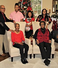 Three generations of the Lewis family will be celebrating Christmas at home in Mechanicsville. They are, standing from left, Jezmon Lewis, Brandon Lewis, Amber Lewis with the family dog, Ella, and Nickkol Lewis. Seated are Mr. Lewis’ mother, Deborah Miller, left, and Mrs. Lewis’ mother, Deborah Joseph.