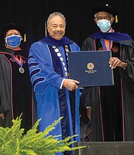 Virginia State University commencement speaker Dr. William R. Harvey, longtime president of Hampton University, center, and Charlie Hill, second from right, a founding board member of the Community Free Clinic of Newport News and a Virginia State University alumnus who serves on the VSU Board of Visitors, smile after being awarded an honorary degree at VSU’s fall commencement ceremony last Saturday. With them are, from left, VSU President Makola Abdullah; Dr. Valerie Brown, VSU rector; and Dr. Donald E. Palm, VSU provost and senior vice president for academic and student affairs.