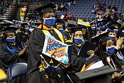Sonia Jackson, 72, who was awarded a bachelor of science in nursing from Virginia State University at last Saturday’s fall commencement is recognized by fellow graduates and the audience. She is the inaugural graduate of VSU’s online degree program.