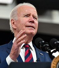 The White House said during his call on Monday, Biden would "discuss his Administration's response to the Omicron variant and ... hear from the Governors on the needs in their States."
Mandatory Credit:	Nicholas Kamm/AFP/Getty Images