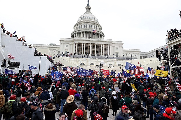 The Justice Department released a three-hour video of a battle between rioters and the police at the US Capitol Building on January 6 where rioters brandished weapons, officers were viciously beaten, and a member of the mob died on Capitol steps.
Mandatory Credit:	Tasos Katopodis/Getty Images