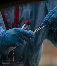 The US Centers for Disease Control and Prevention is shortening the isolation time for health care workers who test positive for Covid-19.
Mandatory Credit:	Chet Strange/Bloomberg/Getty Images