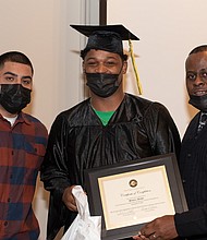 Vernon Owens, Director of Programs of The Dovetail Project, with a graduate of the program aimed to make young fathers better men and better members of their communities. Photo provided by Aileen Bedeau.