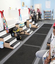 Michelle Millett, 30, provides special music and scents to calm pets at her shop, Diamonds and Dutch Pet Bath & Spa on Brookland Park Boulevard.