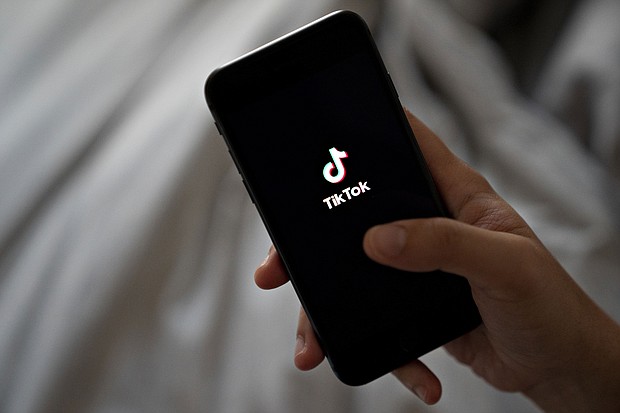 Signage for ByteDance Ltd.'s TikTok app is displayed on a smartphone in an arranged photograph taken in Arlington, Virginia, U.S., on Monday, Aug. 3, 2020.
	Andrew Harrer/Bloomberg/Getty Images