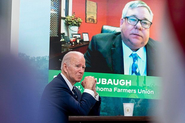 President Joe Biden attends a virtual meeting with family and independent farmers and ranchers including Scott Blubaugh, President, Oklahoma Farmers Union, visible on the monitor.
Andrew Harnik/AP