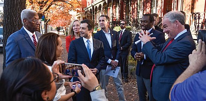 U.S. Secretary of Transportation Pete Buttigieg, center, listens as Virginia elected officials detail how Jackson Ward was dissected by the construction of Interstate 95. With him on the walking tour of the Richmond neighborhood on Dec. 3 are from left, U.S. Rep. A. Donald McEachin, U.S. Rep. Abigail Spanberger, Gov. Ralph S. Northam, Mayor Levar M. Stoney and U.S. Sen. Tim Kaine.