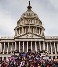 Two weeks before becoming president, Joe Biden watched the January 6 attack on television from his home in Delaware, horrified as the unspeakable images of the insurrection unfolded and aghast at the sitting President's unwillingness to condemn it.
	Jon Cherry/Getty Images