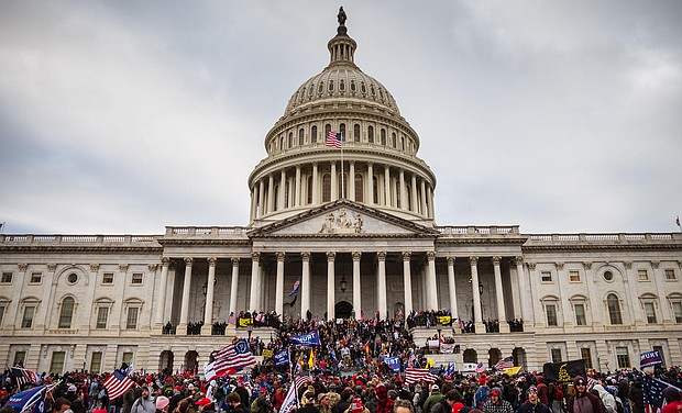 Two weeks before becoming president, Joe Biden watched the January 6 attack on television from his home in Delaware, horrified as the unspeakable images of the insurrection unfolded and aghast at the sitting President's unwillingness to condemn it.
	Jon Cherry/Getty Images
