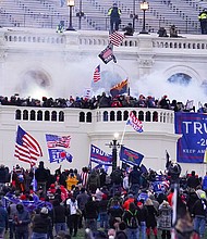 Rioters on the West Front at the U.S. Capitol on Jan. 6, 2021, in Washington, and now, there are fourteen recommended reads about the January 6.
	John Minchillo/AP