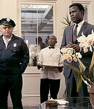 Sidney Poitier with  Rod Steiger on the set of "In the Heat of the Night,"  directed by Norman Jewison.
United Artists/Sunset Boulevard/Corbis/Getty Images