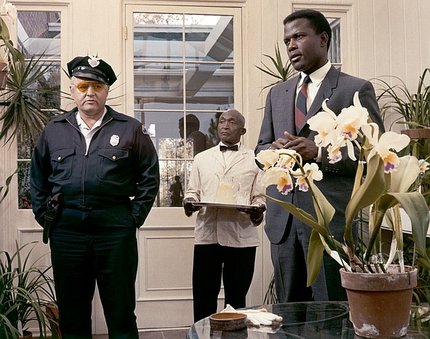 Sidney Poitier with  Rod Steiger on the set of "In the Heat of the Night,"  directed by Norman Jewison.
United Artists/Sunset Boulevard/Corbis/Getty Images