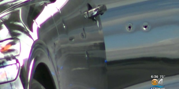 A Honda SUV riddled with bullet holes sits on a Miami, Florida road after its driver was the victim of a road rage shooting. Some worry these shooting have reached epidemic proportions.
	WFOR