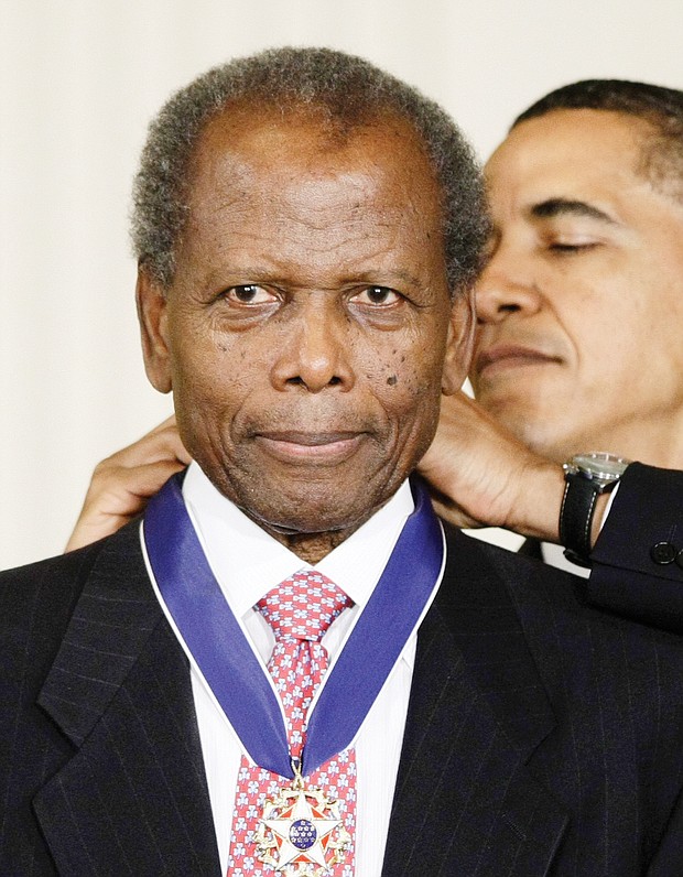 President Obama presents Sidney Poitier with the Presidential Medal of Freedom in August 2009.