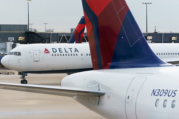 A strong holiday travel season helped Delta Air Lines, pictured here in Atlanta, Georgia, on December 21, 2021 to a better-than-forecast profit in the last three months of 2021, but it expects to lose money again in the current quarter as Covid infections surge.
Mandatory Credit:	Elijah Nouvelage/Bloomberg/Getty Images