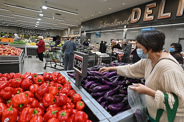 Polls indicate voters are every bit as concerned about the economy as they are about the pandemic. And they feel the government is not doing enough to fight inflation, and pictured, people shop for groceries at a supermarket in Glendale, California, on January 12.
Mandatory Credit:	Robyn Beck/AFP/Getty Images