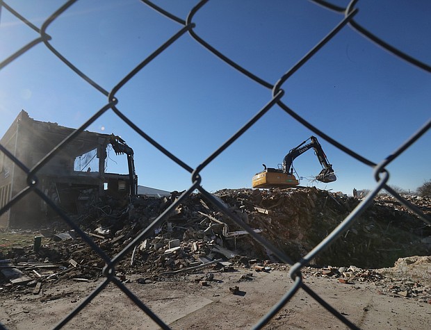 Crews with heavy equipment have started demolishing the former George Mason Elementary School at 29th and O streets in Church Hill. The school building, which is 99-years-old, was replaced by Henry L. Marsh III Elementary School. Demolition was authorized in mid-2020 when City Council voted 6-3 to clear the old building and its two later additions. The new adjacent school, which formally was opened in September, is named for Mr. Marsh, 88, a retired civil rights lawyer who was Richmond’s first Black mayor and a former state senator. He attended George Mason Elementary School de- cades ago. Supporters of the demolition said removing the building that dates to 1922 would provide needed space for an expanded playground for Marsh Elemen- tary students. Foes of demolition saw the historic building as ripe for conversion to elderly housing that would have allowed young people at the school to interact with elders and create a stream of revenue for the public school system.