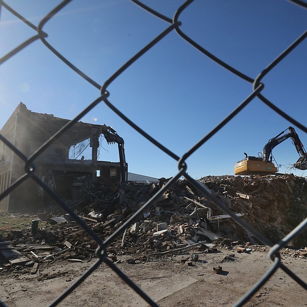 Crews with heavy equipment have started demolishing the former George Mason Elementary School at 29th and O streets in Church Hill. The school building, which is 99-years-old, was replaced by Henry L. Marsh III Elementary School. Demolition was authorized in mid-2020 when City Council voted 6-3 to clear the old building and its two later additions. The new adjacent school, which formally was opened in September, is named for Mr. Marsh, 88, a retired civil rights lawyer who was Richmond’s first Black mayor and a former state senator. He attended George Mason Elementary School de- cades ago. Supporters of the demolition said removing the building that dates to 1922 would provide needed space for an expanded playground for Marsh Elemen- tary students. Foes of demolition saw the historic building as ripe for conversion to elderly housing that would have allowed young people at the school to interact with elders and create a stream of revenue for the public school system.