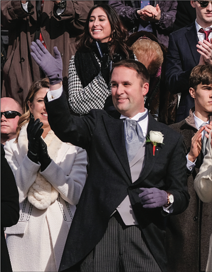 Jason Miyares waves to the crowd after he is sworn in as Virginia’s first Latino attorney general.