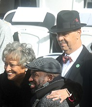 Kay Cole James, Virginia’s new secretary of the commonwealth, and her husband, Charles E. James, right, stop for a photo with Richmond Mayor Levar M. Stoney during Saturday’s inaugural festivities.