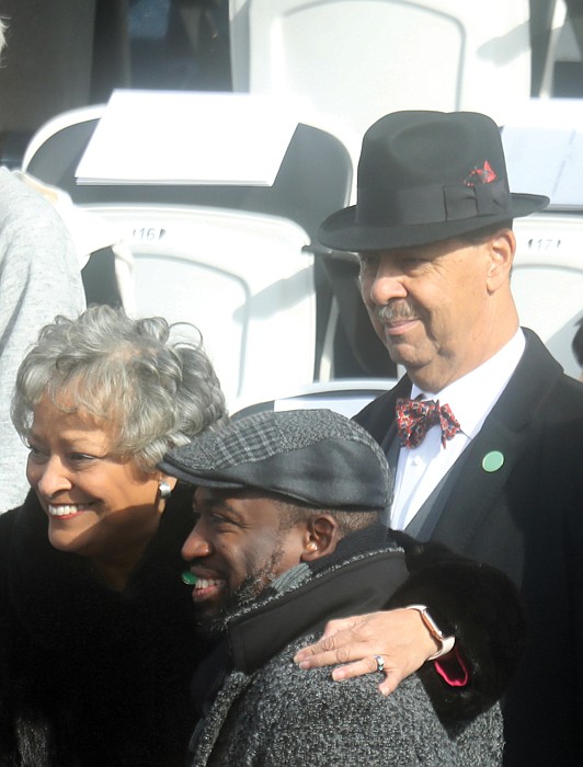 Kay Cole James, Virginia’s new secretary of the commonwealth, and her husband, Charles E. James, right, stop for a photo with Richmond Mayor Levar M. Stoney during Saturday’s inaugural festivities.