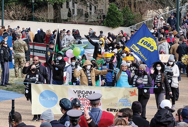 Students from Richmond’s Martin Luther King Jr. Middle School STEM program march in the inaugural parade last Saturday in Capitol Square. Democrats have accused Gov. Glenn A. youngkin of ignoring science and state law with his executive order to lift mask mandates in public schools that were put in place to protect students, teachers and staff from COVID-19.