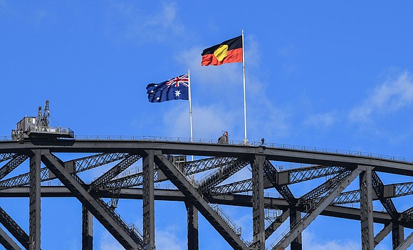 Australia's government has bought the copyright to the Aboriginal flag, making it freely available for public use and ending a …