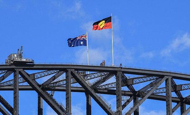 The Australian national flag flies alongside the Aboriginal flag atop the Sydney Harbour Bridge on May 26, 2020 in Sydney, Australia.
Mandatory Credit:	James D. Morgan/Getty Images
