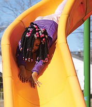 Kaniya Jones obviously enjoyed a chance to glide and slide at the Hotchkiss Field Community Center’s playground. The 7-year-old who lives on Richmond’s South Side had the day off from school Monday thanks to a teachers’ work day for Richmond Public Schools.