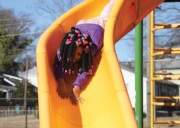 Kaniya Jones obviously enjoyed a chance to glide and slide at the Hotchkiss Field Community Center’s playground. The 7-year-old who lives on Richmond’s South Side had the day off from school Monday thanks to a teachers’ work day for Richmond Public Schools.